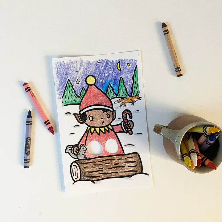 A colored in (with crayons) illustrated elf holiday card.