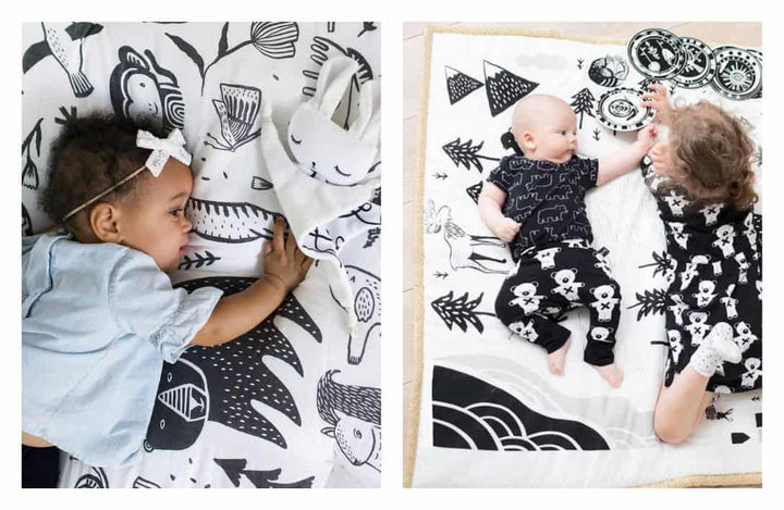 Collage of baby's on black and white illustrated print play mats.