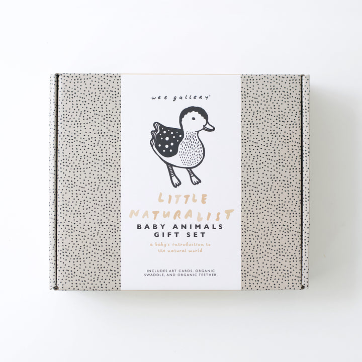 Little Naturalist Gift Set box with an illustration of a baby duck and black dots on brown background.