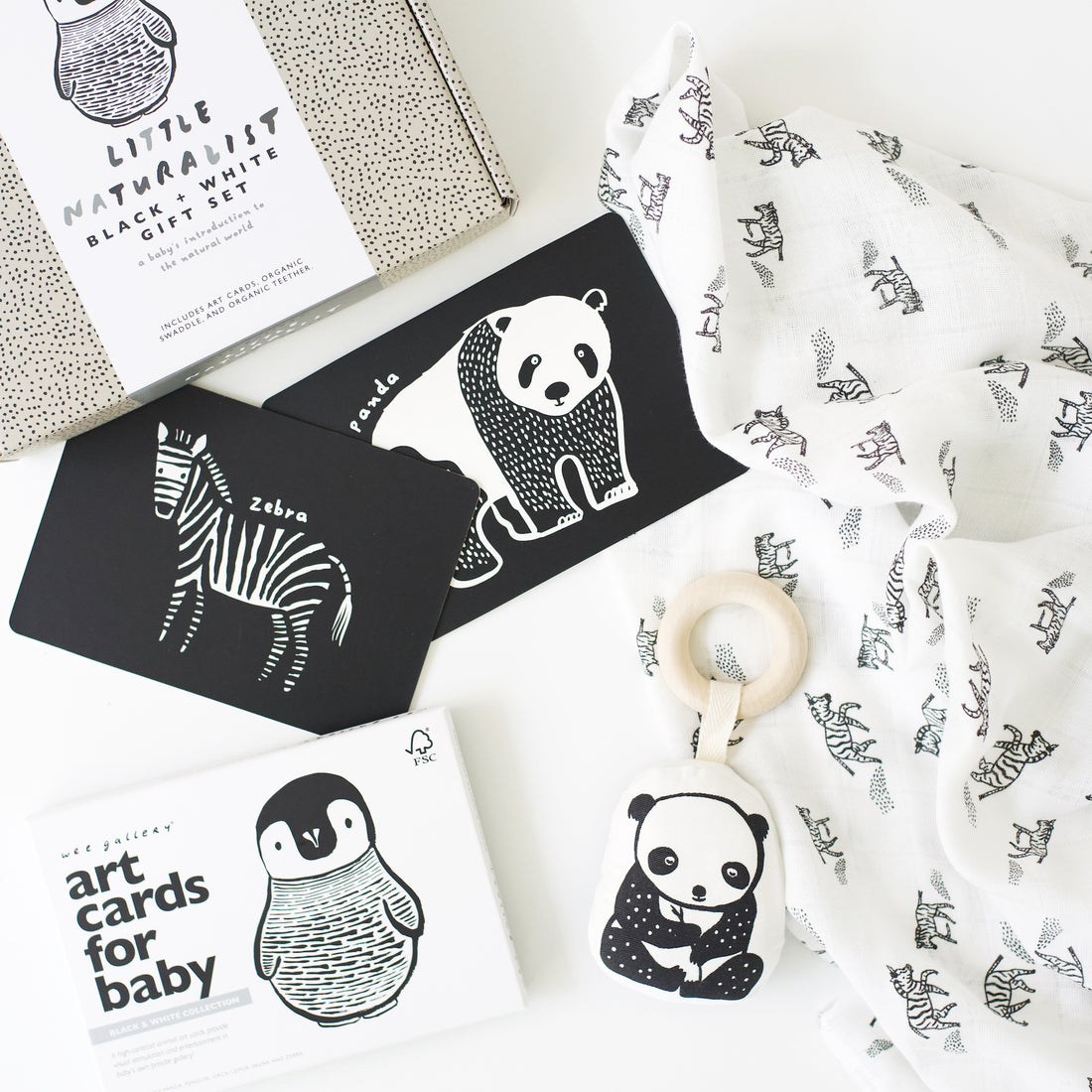https://weegallery.com/cdn/shop/products/organic-unisex-high-contrast-gift-set-for-baby-newborn-2-3-4-5-months-black-and-white_1100x.jpg?v=1667228918